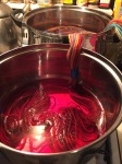 Yarn samples in Strawberry over-dye batch